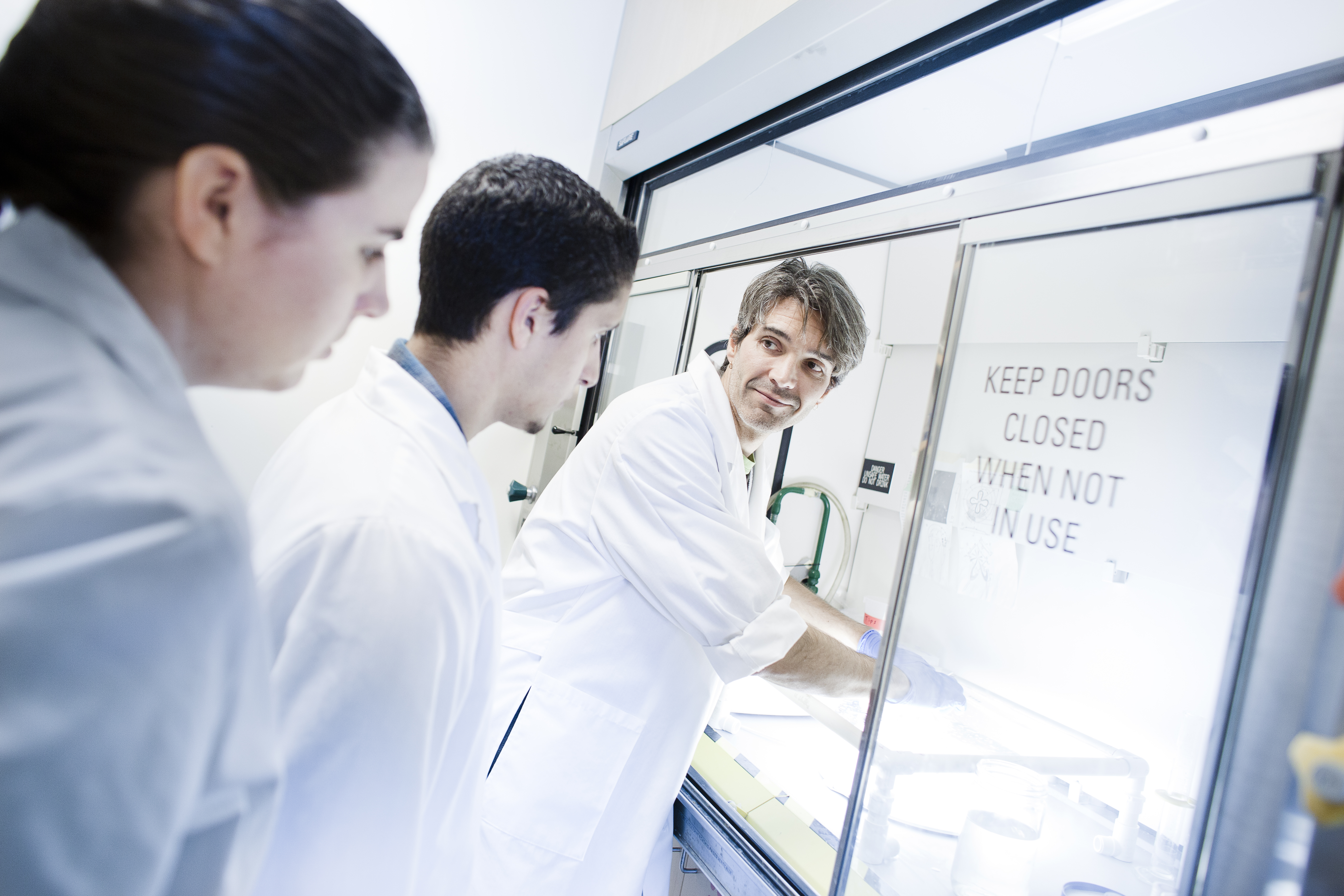 Professor Mike Dawson and students in the lab